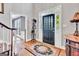 Foyer featuring hardwood floors, an elegant rug, and a view to the front door at 4250 Edgewater Nw Ct, Kennesaw, GA 30144