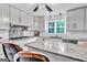 Well-appointed kitchen with granite counters, modern appliances, and ample cabinet space and backsplash, perfect for cooking at 4250 Edgewater Nw Ct, Kennesaw, GA 30144