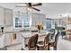 Bright, airy kitchen with granite countertops, stainless steel appliances, and a breakfast bar with seating and view to dining space at 4250 Edgewater Nw Ct, Kennesaw, GA 30144