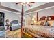 Cozy main bedroom boasts a four-poster bed, sitting area, and elegant decor at 4250 Edgewater Nw Ct, Kennesaw, GA 30144