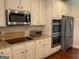 Updated kitchen with granite countertops, stainless steel appliances, double oven, and modern microwave at 101 Elkins Blvd, Locust Grove, GA 30248