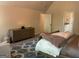 Spacious bedroom with wood dresser, blue patterned rug, and comfortable king bed at 101 Elkins Blvd, Locust Grove, GA 30248