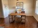 Office features hardwood floors, wood desk and chair, and neutral wall color at 101 Elkins Blvd, Locust Grove, GA 30248