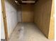 Unfinished basement showing concrete walls and floor, perfect for storage or future renovation at 115 Stable Creek Rd, Fayetteville, GA 30215