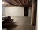 Unfinished basement with concrete floor and studded walls, offering potential for customization at 115 Stable Creek Rd, Fayetteville, GA 30215
