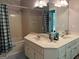 Bathroom featuring a shower and tub combination and a large vanity with double sinks at 115 Stable Creek Rd, Fayetteville, GA 30215