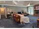 Spacious living room featuring a fireplace, coffered ceilings and recessed lighting at 115 Stable Creek Rd, Fayetteville, GA 30215