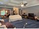 Expansive living room with coffered ceilings and hardwood floors, offering a versatile space at 115 Stable Creek Rd, Fayetteville, GA 30215