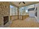 Relaxing back deck with stone fireplace and wood railing at 135 Wet Wood Dr # 12, Fairburn, GA 30213