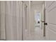 Bright bathroom with a decorative shower curtain, white tiles, and stylish fixtures at 135 Wet Wood Dr # 12, Fairburn, GA 30213