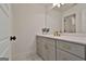 Elegant bathroom featuring a gray vanity with gold hardware, a white countertop, and modern fixtures at 135 Wet Wood Dr # 12, Fairburn, GA 30213