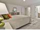 Serene bedroom featuring a plush bed, dresser, and carpet, creating a comfortable retreat at 135 Wet Wood Dr # 12, Fairburn, GA 30213
