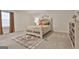 Inviting bedroom featuring a decorative bed frame, neutral decor, and a patterned area rug at 135 Wet Wood Dr # 12, Fairburn, GA 30213