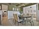 Elegant dining room with modern chandelier and seating for six at 135 Wet Wood Dr # 12, Fairburn, GA 30213