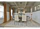 Elegant dining room with coffered ceiling, modern chandelier, and stylish decor at 135 Wet Wood Dr # 12, Fairburn, GA 30213