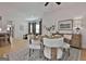 Bright dining room with stylish decor, hardwood floors, and plenty of natural light, perfect for entertaining at 135 Wet Wood Dr # 12, Fairburn, GA 30213