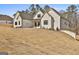 A beautifully constructed one-story home with painted brick exterior and a gently sloping lawn at 135 Wet Wood Dr # 12, Fairburn, GA 30213