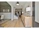 Grand foyer with light wood floors, staircase with black metal spindles, and stylish console table at 135 Wet Wood Dr # 12, Fairburn, GA 30213