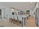 Modern kitchen boasts white cabinets, stainless appliances, and breakfast bar seating for four at 135 Wet Wood Dr # 12, Fairburn, GA 30213
