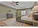 Well lit main bedroom features a trey ceiling, neutral decor and lots of natural light at 135 Wet Wood Dr # 12, Fairburn, GA 30213