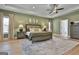 Relaxing main bedroom features soothing colors, hardwood flooring, trey ceiling and neutral decor at 135 Wet Wood Dr # 12, Fairburn, GA 30213