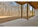 Covered patio perfect for outdoor living, with natural wood and an expansive view of the backyard at 135 Wet Wood Dr # 12, Fairburn, GA 30213