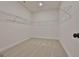 Empty walk-in closet with plenty of shelving, carpeting and is waiting for its new owner at 135 Wet Wood Dr # 12, Fairburn, GA 30213