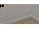 Shows wall with baseboard and door trim and carpeted floors at 135 Wet Wood Dr # 12, Fairburn, GA 30213