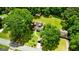 Aerial view of property with lush trees, verdant lawns, and a charming walkway leading to the front door at 3777 Edward Rd, Rex, GA 30273