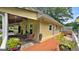 Cozy outdoor patio area including a dining set, a ceiling fan, and decorative plants in decorative pots at 3777 Edward Rd, Rex, GA 30273
