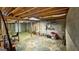 Unfinished basement featuring exposed beams, concrete walls, bike and storage, and tool storage at 3777 Edward Rd, Rex, GA 30273