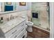 Updated bathroom featuring a marble vanity, modern fixtures, tiled walls, and a glass enclosed shower at 3777 Edward Rd, Rex, GA 30273