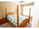Cozy bedroom showcasing a wooden bed frame and a sun-filled window at 3777 Edward Rd, Rex, GA 30273