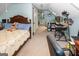 Bedroom setup as flex space, including bed with floral linens, dresser and table setup as an office at 3777 Edward Rd, Rex, GA 30273