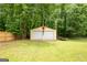 Detached two-car garage with a 'STOP' sign and ample backyard space at 3777 Edward Rd, Rex, GA 30273