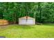 View of a two-car storage shed with a 'Stop' sign, adjacent to the house at 3777 Edward Rd, Rex, GA 30273