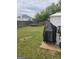 Lush backyard with a trampoline, dining area, grill, and privacy fence perfect for outdoor enjoyment at 1871 Sandy Trail Dr, Hampton, GA 30228