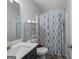 Bathroom featuring a vanity, toilet, and shower with a patterned curtain at 1871 Sandy Trail Dr, Hampton, GA 30228
