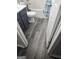 Cozy bathroom with gray plank flooring, gray vanity, and white toilet at 1871 Sandy Trail Dr, Hampton, GA 30228