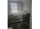 Bedroom features carpet, a queen-sized bed, and bright natural light from window at 1871 Sandy Trail Dr, Hampton, GA 30228