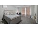 Comfortable bedroom with neutral walls, carpet floors, full size bed, vanity table and lighted mirror, and curtains at 1871 Sandy Trail Dr, Hampton, GA 30228