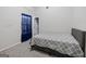 Bedroom with carpet, blue curtains, and a bed with a grey patterned quilt at 1871 Sandy Trail Dr, Hampton, GA 30228