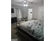 Cozy bedroom featuring ceiling fan, carpet, and a view of the attached bath at 1871 Sandy Trail Dr, Hampton, GA 30228