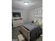 Bedroom featuring neutral walls, carpet, and a full bed with a TV on the dresser at 1871 Sandy Trail Dr, Hampton, GA 30228