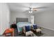 Bedroom with carpet, ceiling fan, and a bed with blue cover at 1871 Sandy Trail Dr, Hampton, GA 30228