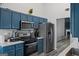 Well-equipped kitchen with stainless steel appliances and gray backsplash at 1871 Sandy Trail Dr, Hampton, GA 30228
