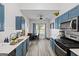 Stylish kitchen with granite countertops and stainless steel appliances at 1871 Sandy Trail Dr, Hampton, GA 30228