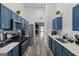 Well-equipped kitchen with stainless steel appliances and gray backsplash at 1871 Sandy Trail Dr, Hampton, GA 30228