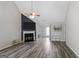 Spacious living room with a fireplace and large windows at 1871 Sandy Trail Dr, Hampton, GA 30228