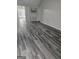 Bright and airy living room with new floors, modern decor, and ample natural light at 1871 Sandy Trail Dr, Hampton, GA 30228